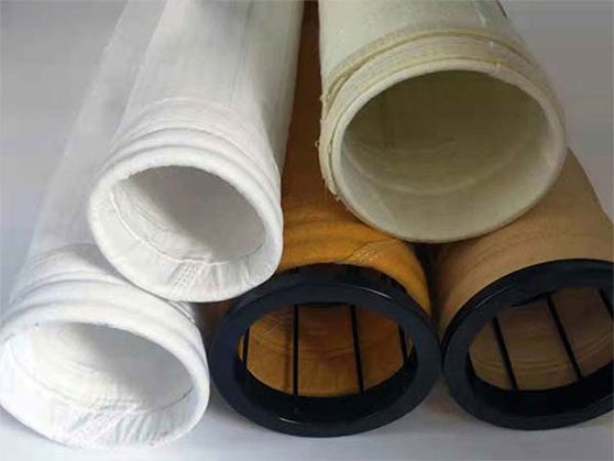 Dust-collector-filter-bag-2 Different types of filter cloths arranged, highlighting a white and yellow dust collector filter bag.