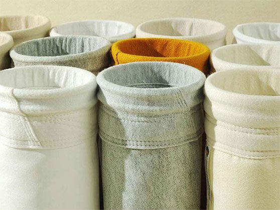 Dust-collector-filter-bag Various filter cloths displayed, including a white and yellow dust collector filter bag among them.
