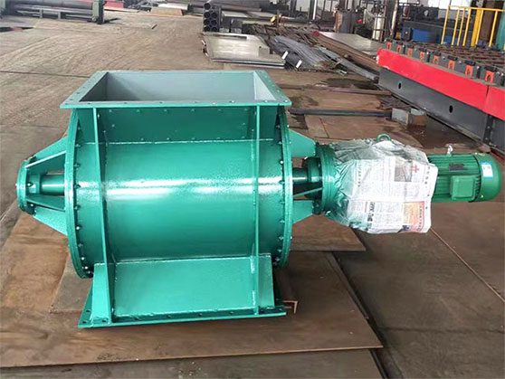 Rotary-Valve 6 An industrial rotary valve machine with a green cover, highlighting its substantial metal framework and functionality.