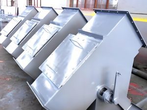 A series of metal boxes, indicative of a Two Way Diverter Gate Valve, organized in a stacked formation.