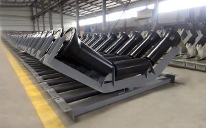 A row of conveyor rollers is positioned in the factory, efficiently transporting materials along the production line.
