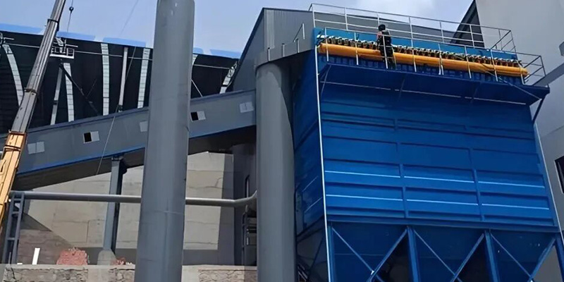 Pulse baghouse dust collector installation site for belt conveyor transfer point dust control